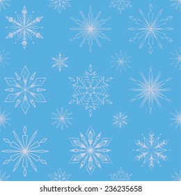 Seamless pattern of blue snowflakes on a blue background