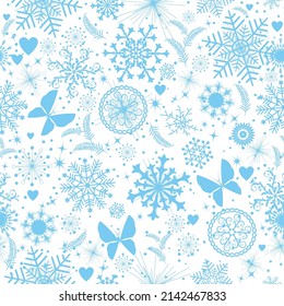 Patrón sin foco con copos de nieve azules y estrellas en un fondo transparente 