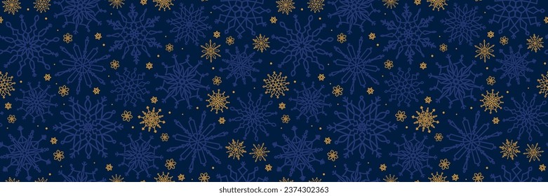 Seamless pattern with blue and yellow snowflakes on a dark blue background