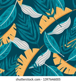 Seamless pattern with blue and yellow tropical leaves. Vector design. Flat jungle print. Floral background.