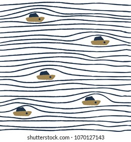 Seamless pattern with boats on blue stripes background