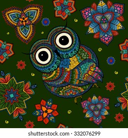 Seamless pattern Boho ornamental owl illustration, ethnics abstract doodle on floral background, sketch of totem animal with feather in tribal decor 