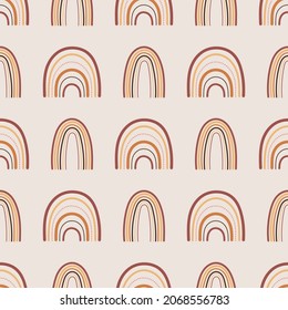 Seamless pattern with boho rainbows in terracotta colors. Neutral nursery art design for decoration, bohemian printing for fabric and wall art. Hand drawn vector illustration.