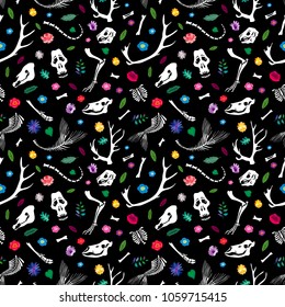 Seamless pattern. Bones of animals among flowers. Great for print on a T-shirt. Ideal for decoration of Halloween and the Day of the Dead.