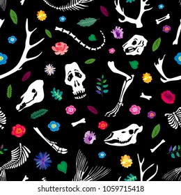 Seamless pattern. Bones of animals among flowers. Ideal for decoration of Halloween and the Day of the Dead.