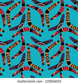 Seamless pattern with boomerangs on blue background