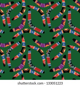 Seamless pattern with boomerangs on green background