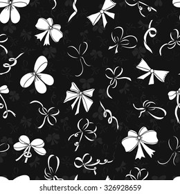 Seamless pattern with bows. White silhouettes of bows on a grey background. Vector illustration.