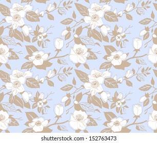 Seamless pattern with a branch of apple blossoms on a blue background
