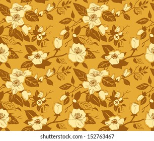 Seamless pattern with a branch of blossoming apple tree on a gold background