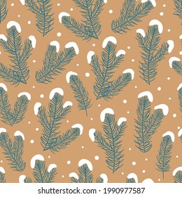 Seamless pattern of branches of a Christmas tree on craft paper. Christmas tree branches in the snow.