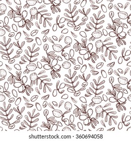Seamless pattern branches, leaves, nuts, fruits, argan tree (ironwood). Suitable for packing Argan oil creams. Vector illustration of a hand drawn style. For scrapbooking, wrapping paper and textiles.