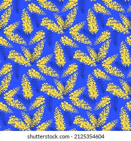 seamless pattern with branches mimosa flower on vivid blue background