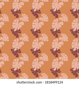 Seamless pattern with branches  of tropical plants monstera leaves isolated on terracotta background. Silhouette vector illustration. Design for  textile, wrapping, backdrop, banner 