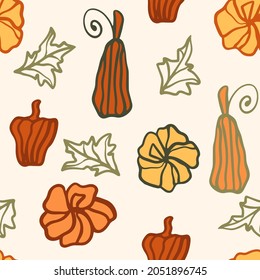 Seamless pattern with bright autumn colored hand-drawn pumpkins. Background with a harvest of pumpkins of different shapes. Template for wallpaper, packaging and fabric for Thanksgiving and Halloween