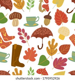 Seamless pattern with bright autumn leaves, mushrooms, umbrellas, socks. For decorating wallpaper, packaging, textiles, tablecloths and bed linen.