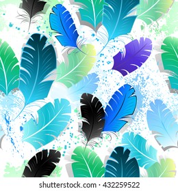 Seamless pattern with bright blue, green and black feathers on white background, shaded paint spots.