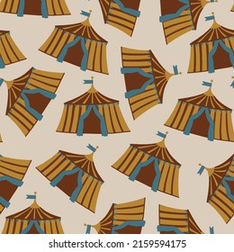 Seamless pattern with bright circus tents on a beige background