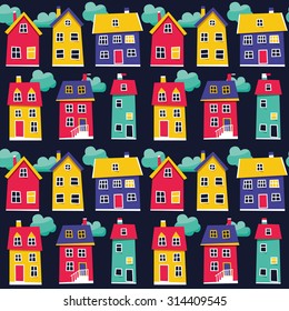 Seamless pattern with bright color houses and clouds