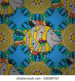 Seamless pattern of bright colorful doodles fishes on blue. Vector.
