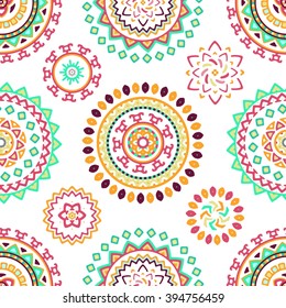Seamless pattern of bright colorful geometric round ethnic decorative elements. Vector mandala background with bohemian, Oriental, Indian, Arabic, Aztec motifs.