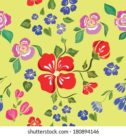 Seamless pattern with bright flowers(red, pink, blue) on a green background. Vector illustration.
