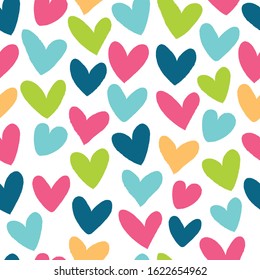 Seamless pattern with bright hearts. Drawn with a brush.