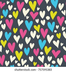 Seamless pattern with bright hearts on a dark background.

