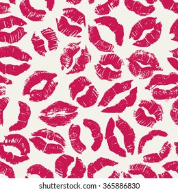 Seamless pattern with bright lipstick kisses. Different imprints of pink lipstick isolated on a white background. Can be used for design of fabric print, wrapping paper or romantic greeting card
