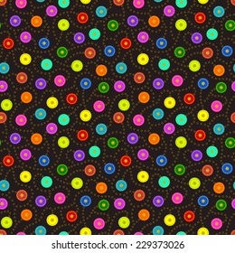 Seamless Pattern - Bright multicolored discs connected together in a seamless pattern by gold colored rings on dark background.