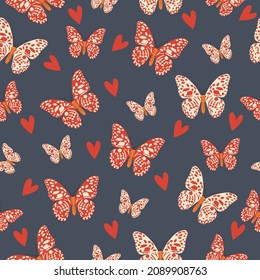 Seamless pattern from bright red butterflies on a dark blue background. vector illustration. 