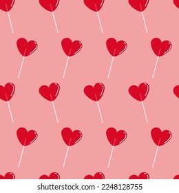 Seamless pattern with bright red heart-shaped lollipops	