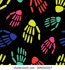  seamless pattern of bright Skeleton hands on a black background. bones pattern. Design for Halloween and day of the Dead