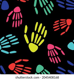  seamless pattern of bright Skeleton hands on a black background. bones pattern. Design for Halloween and day of the Dead