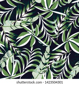 Seamless pattern with bright tropical leaves and plants on a delicate black background. Vector design. Jungle print. Floral background. Printing and textiles. Exotic tropics. Summer design.