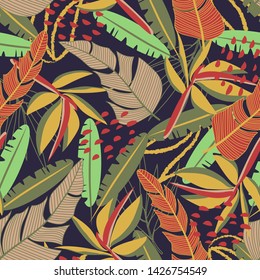 Seamless pattern with bright tropical leaves and plants on a dark background. Vector design. Jungle print. Floral background. Printing and textiles. Exotic tropics. Summer design.