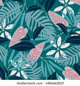 Seamless pattern with bright tropical plants on a dark background. Vector design. Jungle print. Printing and textiles.