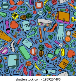 Seamless pattern with bright women accessories on a blue background in vector
