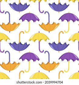 Seamless pattern with bright yellow and purple umbrellas on a white background. Cute autumn print for textiles, wrapping paper and design