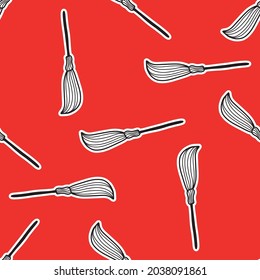 Seamless pattern with broom on a red background .Design for Halloween. vector illustration