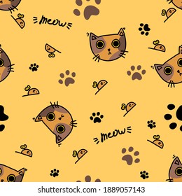 Seamless pattern. Brown playful cat with big eyes, small mouse with a key and black feline footprints. Funny texture in warm brown and orange tones for textile, wrapping paper or background