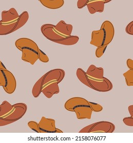 Seamless pattern of brown western cowboy hats. Headwear background. Clothes accessories. Fashion headwear in vintage style. Vector retro illustration.