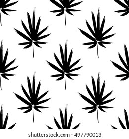 Seamless pattern with brush painted palm leaves. Hand drawn abstract background.