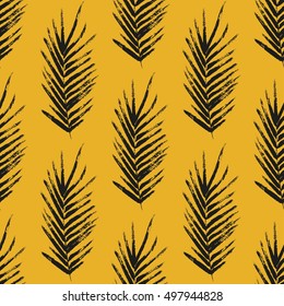 Seamless pattern with brush painted palm leaves. Hand drawn abstract background.