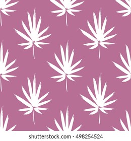 Seamless pattern with brush painted palm leaves. Hand drawn abstract background.