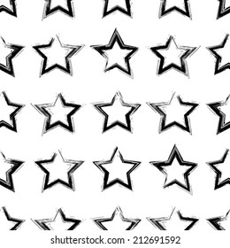 Seamless pattern with brush painted stars. Vector background.