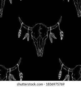 Seamless pattern of bull skulls with feathers on their horns. Vector background. Hand-drawn style.