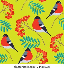 Seamless pattern with bullfinch on rowan branch on yellow background. Seasonal natural pattern with rowan berries. Vector illustration.