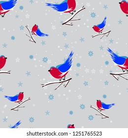 Seamless pattern of bullfinches, blue and white snowflakes, Christmas holiday print background