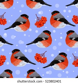 Seamless pattern with bullfinches, rowan berries and snow. Vector illustration on blue background.